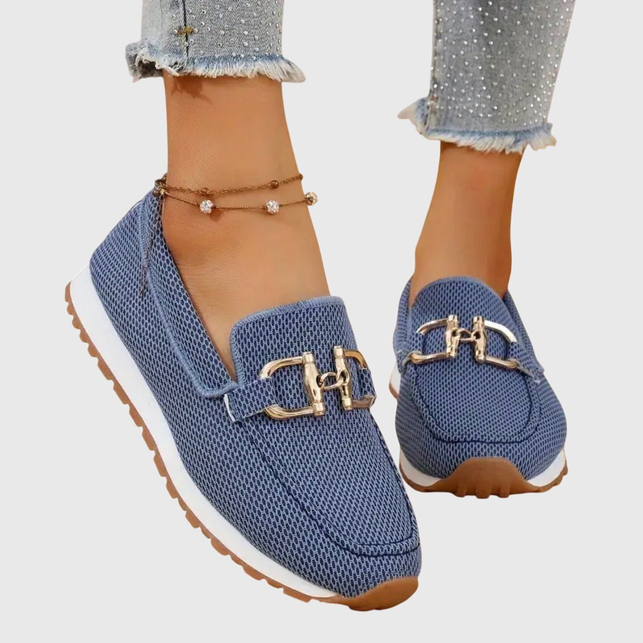 Orthopedic loafers featuring cushioned support and a breathable design, adorned with elegant gold-tone details, perfect for comfort and style. 0